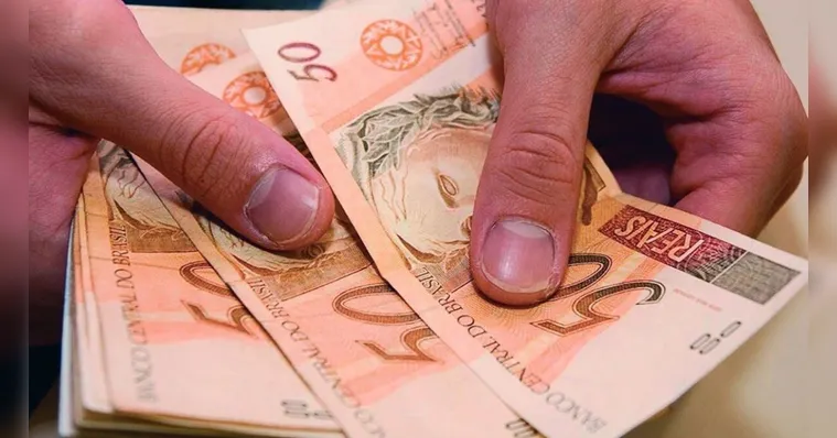 Descubra quando deve ser pago o salário no quinto dia útil de agosto. Entenda os direitos dos trabalhadores e as penalidades para atrasos. | Reprodução/Agência Brasil